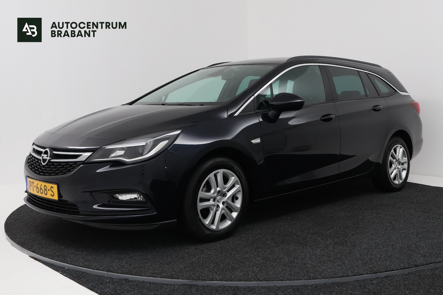 Opel Astra Sports Tourer - 1.4 Business+ (PARKEERSENSOREN, CRUISE CONTROL, NAVIGATIE) - AutoWereld.nl
