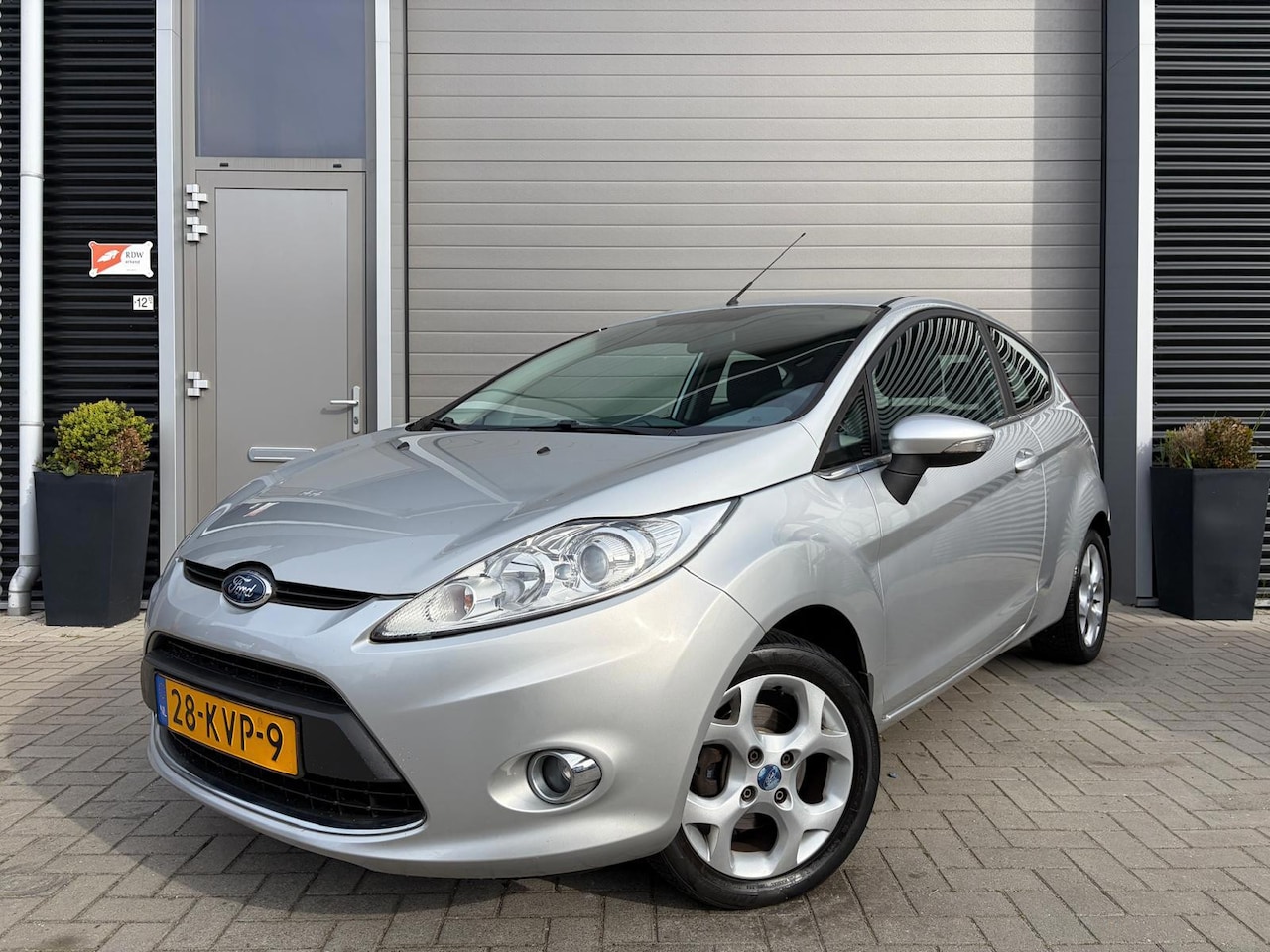 Ford Fiesta - 1.25 Titanium/155.000 NAP/Airco/Lichtmetaal/PDC/ - AutoWereld.nl