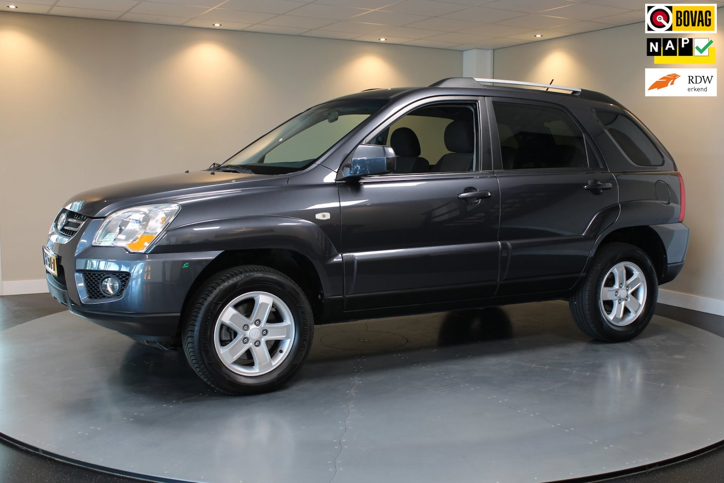 Kia Sportage - 2.0 CVVT X-ecutive *2de Eigenaar* Top onderhouden! Trekhaak|Cruise|Climate|Navi|NAP - AutoWereld.nl