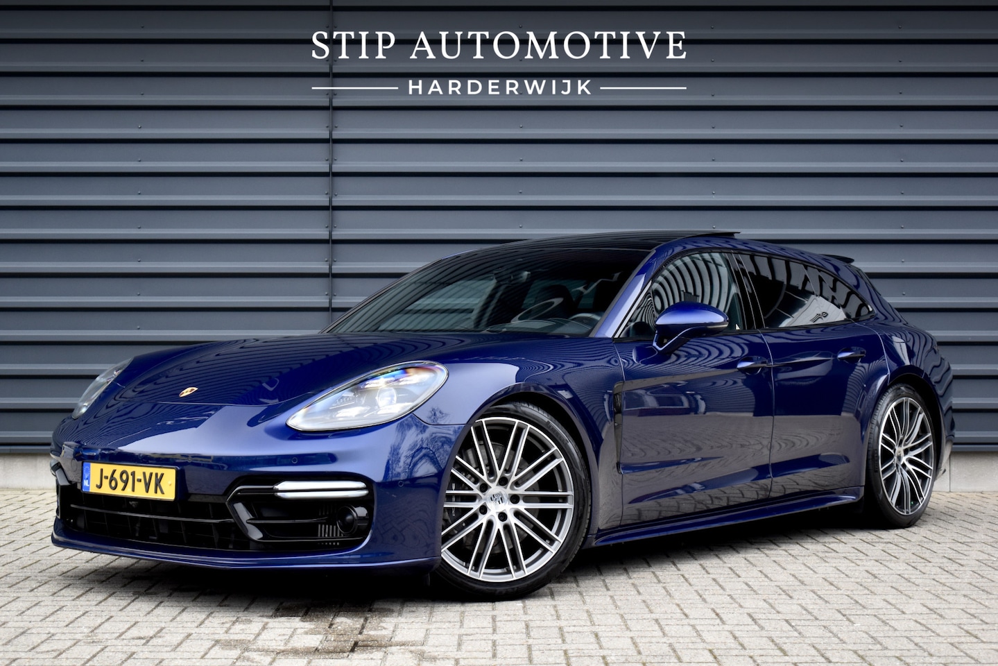 Porsche Panamera Sport Turismo - 2.9 4 E-Hybrid 462pk SportDesign | Pano | ACC | 21'' Wielen | Matrix PDLS+ | Bose | Achter - AutoWereld.nl