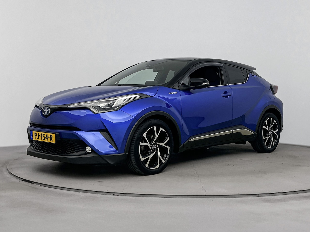 Toyota C-HR - 1.8 Hybrid Bi-Tone Plus | trekhaak | Navigatie |  chrome pakket | - AutoWereld.nl