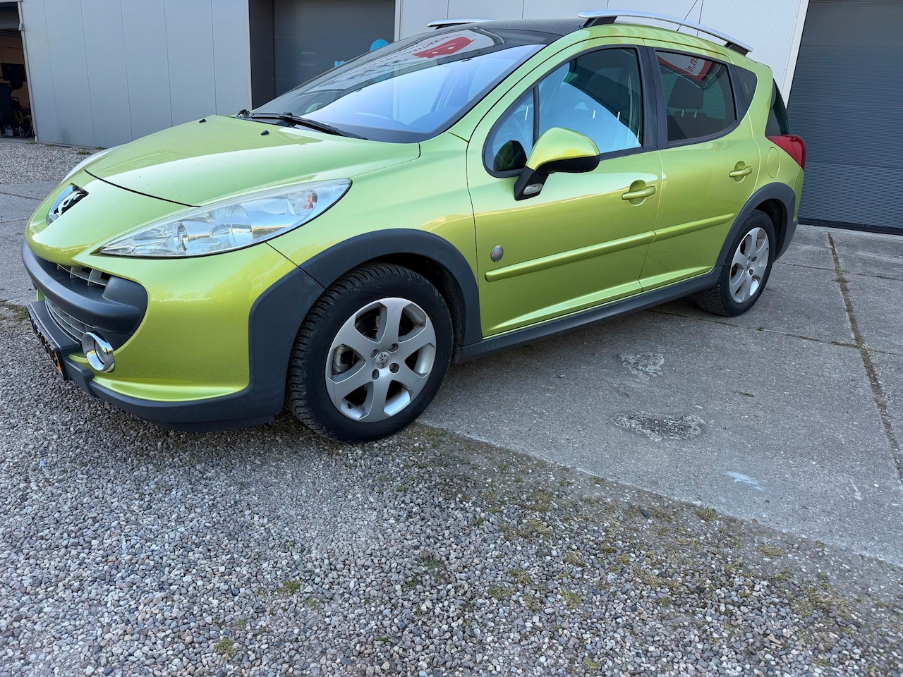 Peugeot 207 SW Outdoor - 1.6 VTi XS met airco en panoramadak - AutoWereld.nl