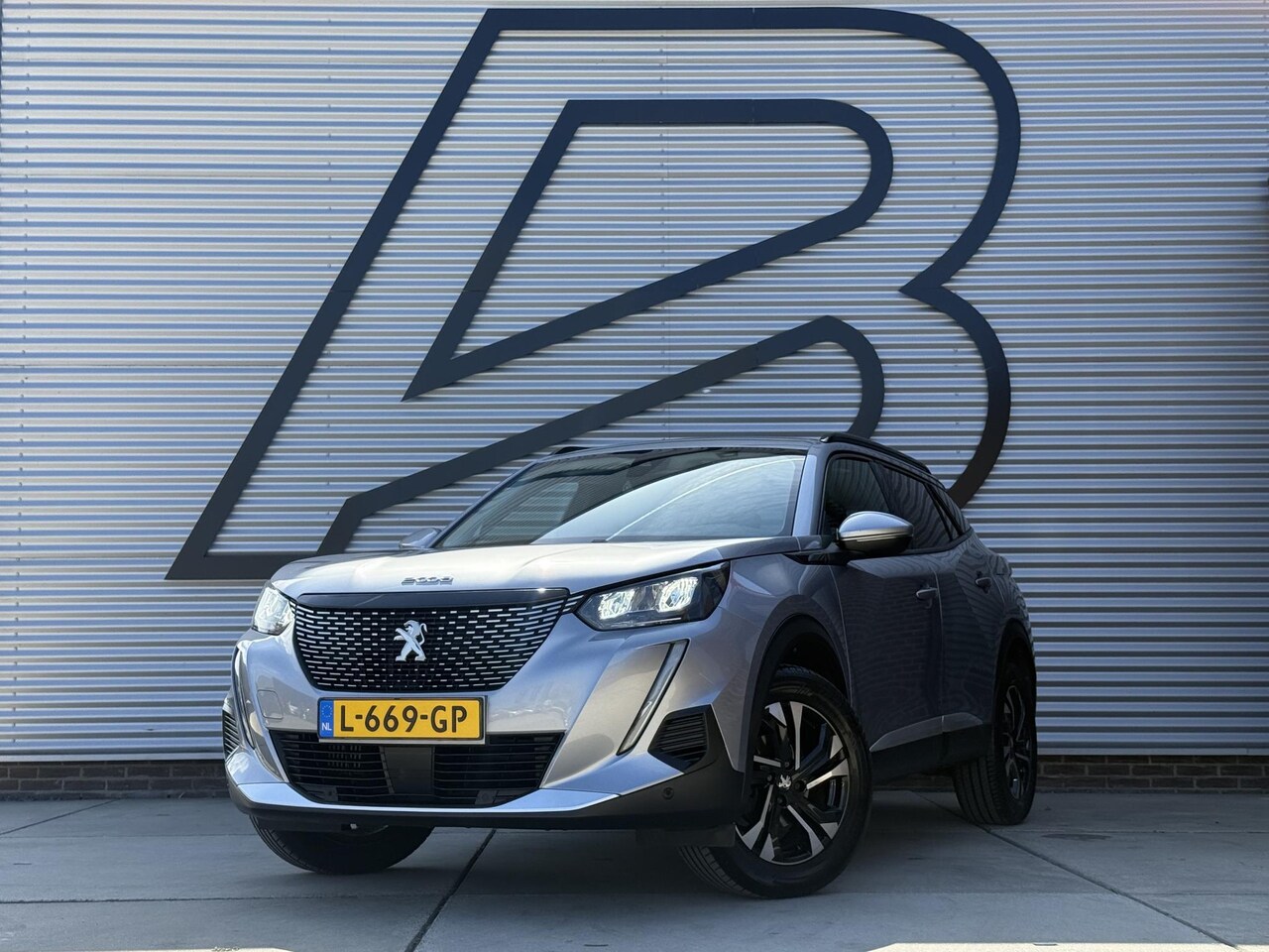 Peugeot 2008 - 1.2 PureTech Blue Lease Allure 2e Eigenaar|Navi|Camera|D-riem v.v. in 2026|Clima|Cruise|Ca - AutoWereld.nl