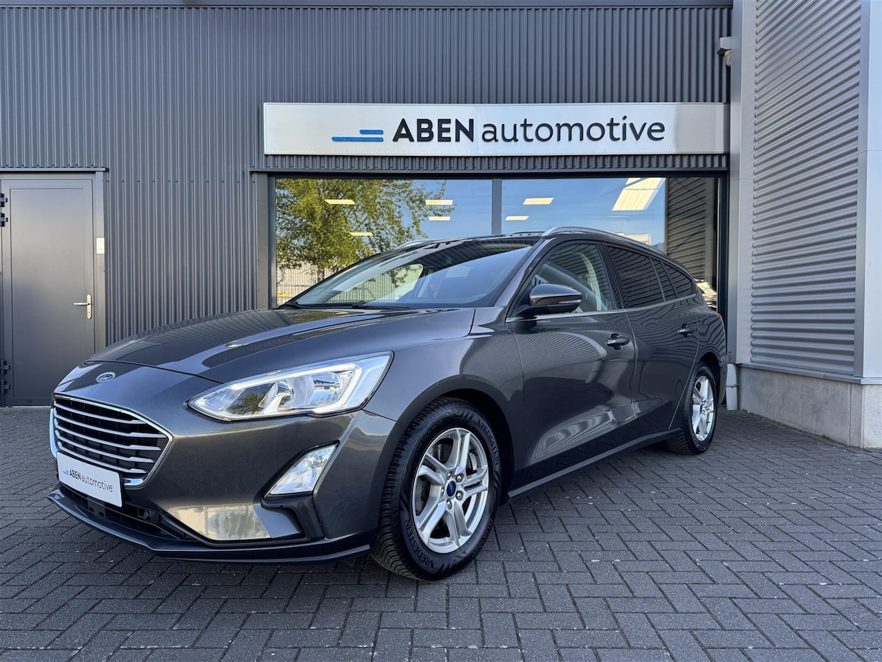 Ford Focus Wagon - 1.0 EcoBoost Titanium 1.0 EcoBoost 100PK Titanium (4-SEIZ.|CAMERA|WINTER PACK|CARPLAY) - AutoWereld.nl