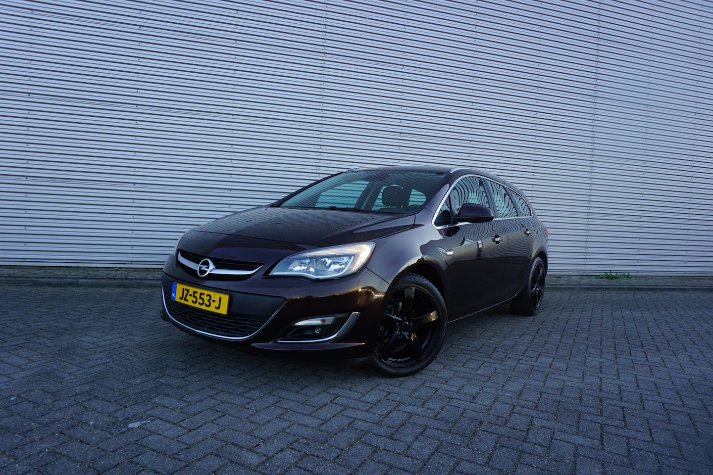 Opel Astra Sports Tourer - 1.4 Turbo Sport + Climate / Navi / Cruise / Camera / Elektr. ramen / Parkeers. / Lm velgen - AutoWereld.nl