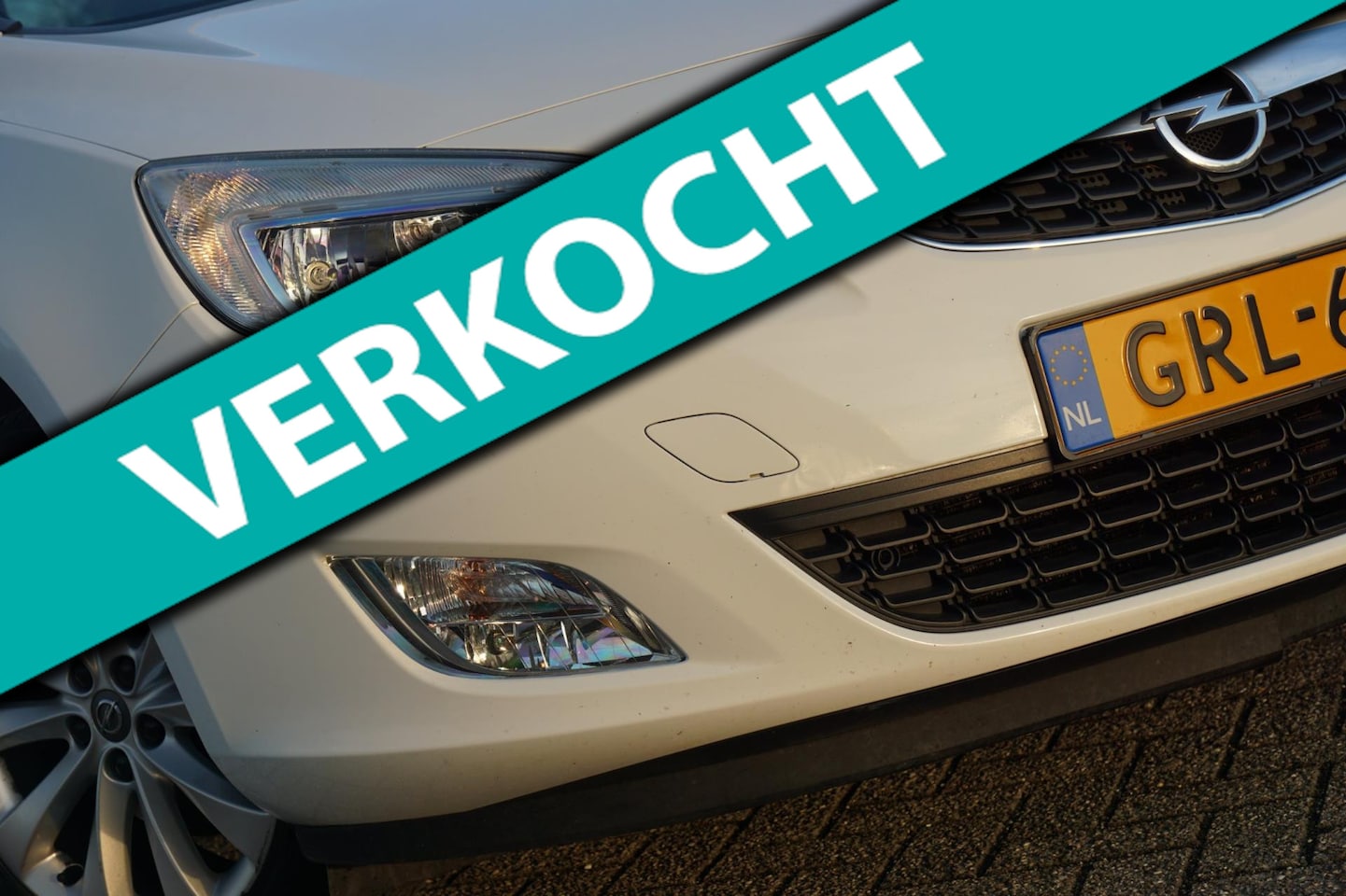 Opel Astra Sports Tourer - 1.4 Turbo 140pk Anniversary Edition - Summit White - Cruise/Clima/PDC - AutoWereld.nl