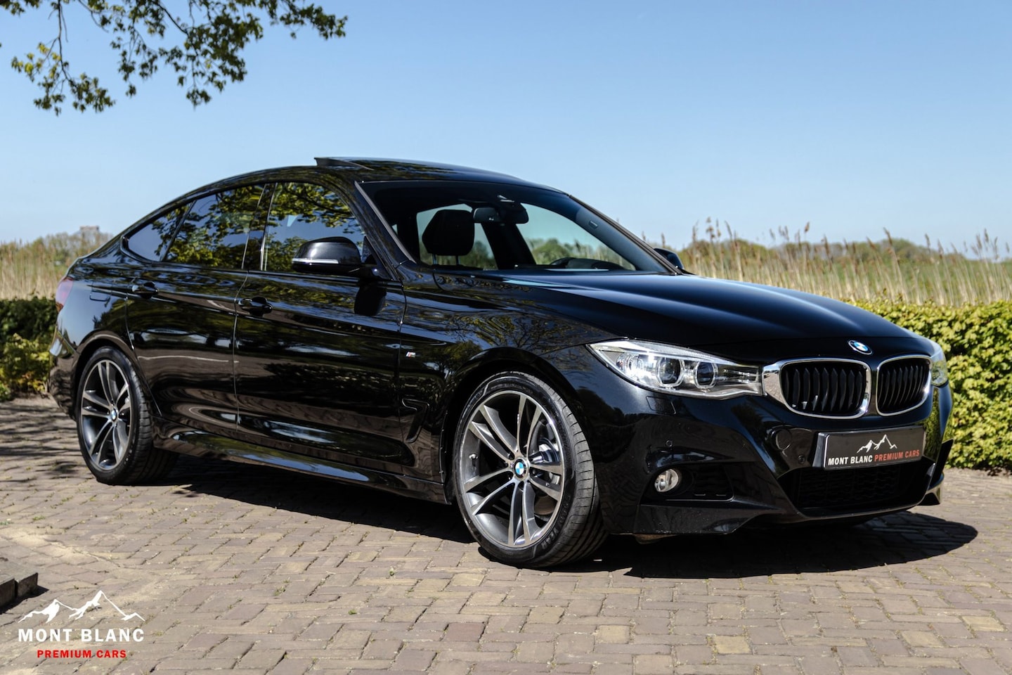 BMW 3-serie Gran Turismo - 328i|M-Pakket|Pano.|HUD|Elek. trekhaak|Stuur verw. - AutoWereld.nl
