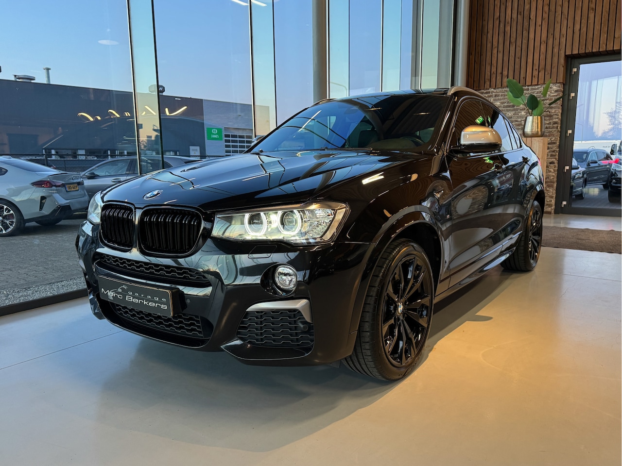 BMW X4 - M40i Centennial High Executive Pano, H+K, trekh. - AutoWereld.nl