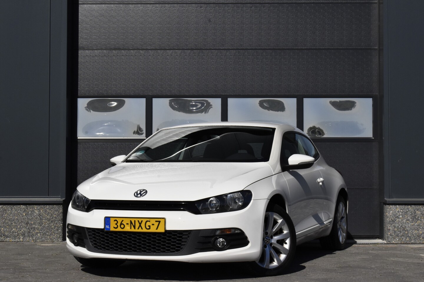 Volkswagen Scirocco - 1.4 TSI Highline Navi - Cruise - Clima - NAP - AutoWereld.nl