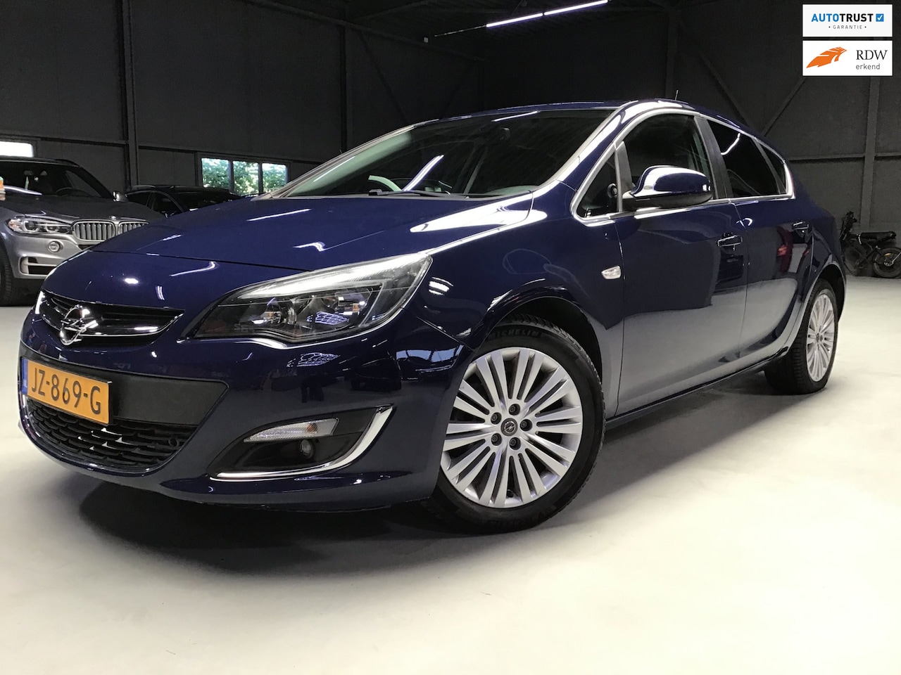 Opel Astra - 1.4 Turbo Cosmo I Automaat I 2e Eigen. I Clima I Cruise I New Waterp. + Apk + Kln Brt I El - AutoWereld.nl