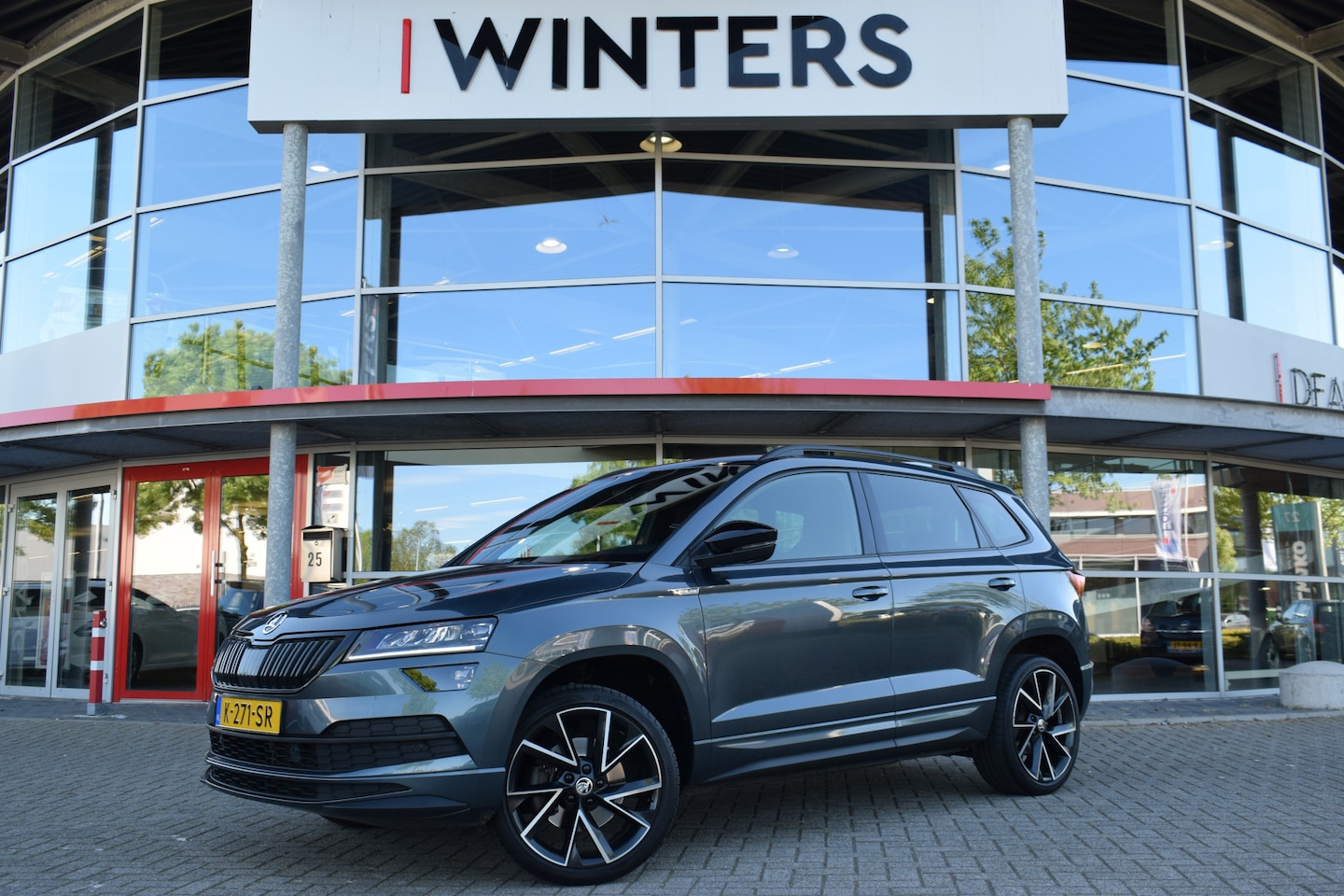 Skoda Karoq - 1.5 TSI ACT Sportline Business | Adaptieve Cruise | Elektrische Kofferbak | Apple Carplay - AutoWereld.nl