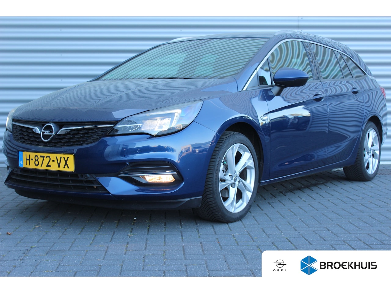 Opel Astra Sports Tourer - 1.2 TURBO 130PK ELEGANCE+ / NAVI / LEDER / CLIMA / AGR / PDC / 17" LMV / CAMERA / TREKHAAK - AutoWereld.nl