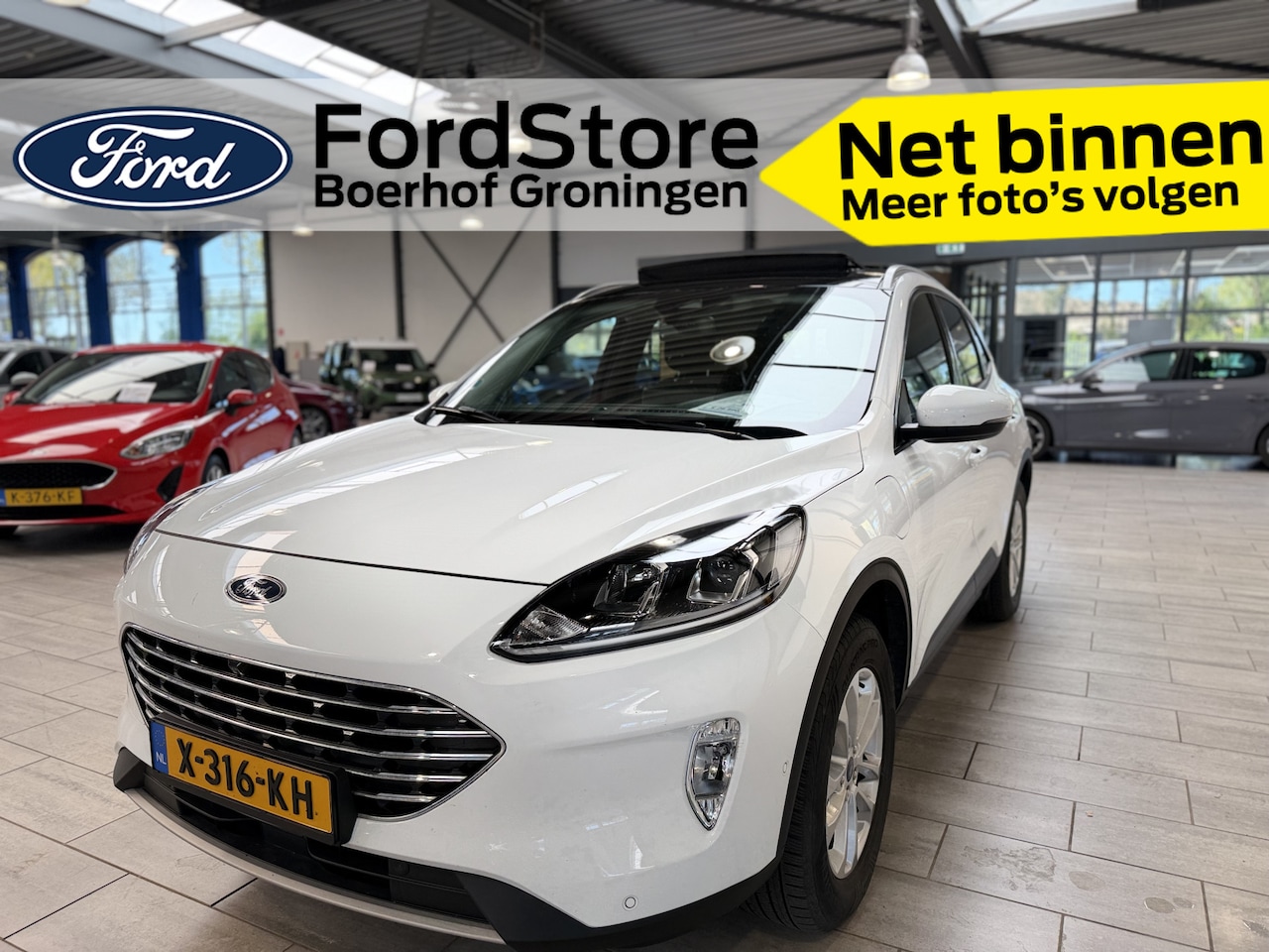 Ford Kuga - 2.5 PHEV 225 pk Titanium | Trekhaak | Pano | Camera's | Adapt. cruise | 4 seiz. banden | 1 - AutoWereld.nl