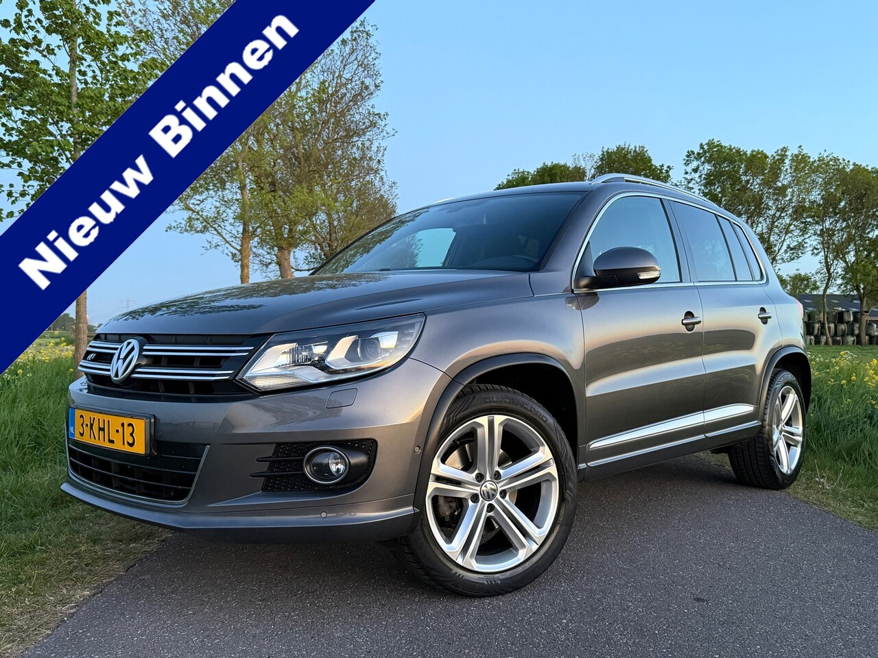 Volkswagen Tiguan - 2.0 TSI Sport&Style 4Motion R-Line Automaat | 2e Eigenaar | Navi | 18" Velgen | Trekhaak | - AutoWereld.nl