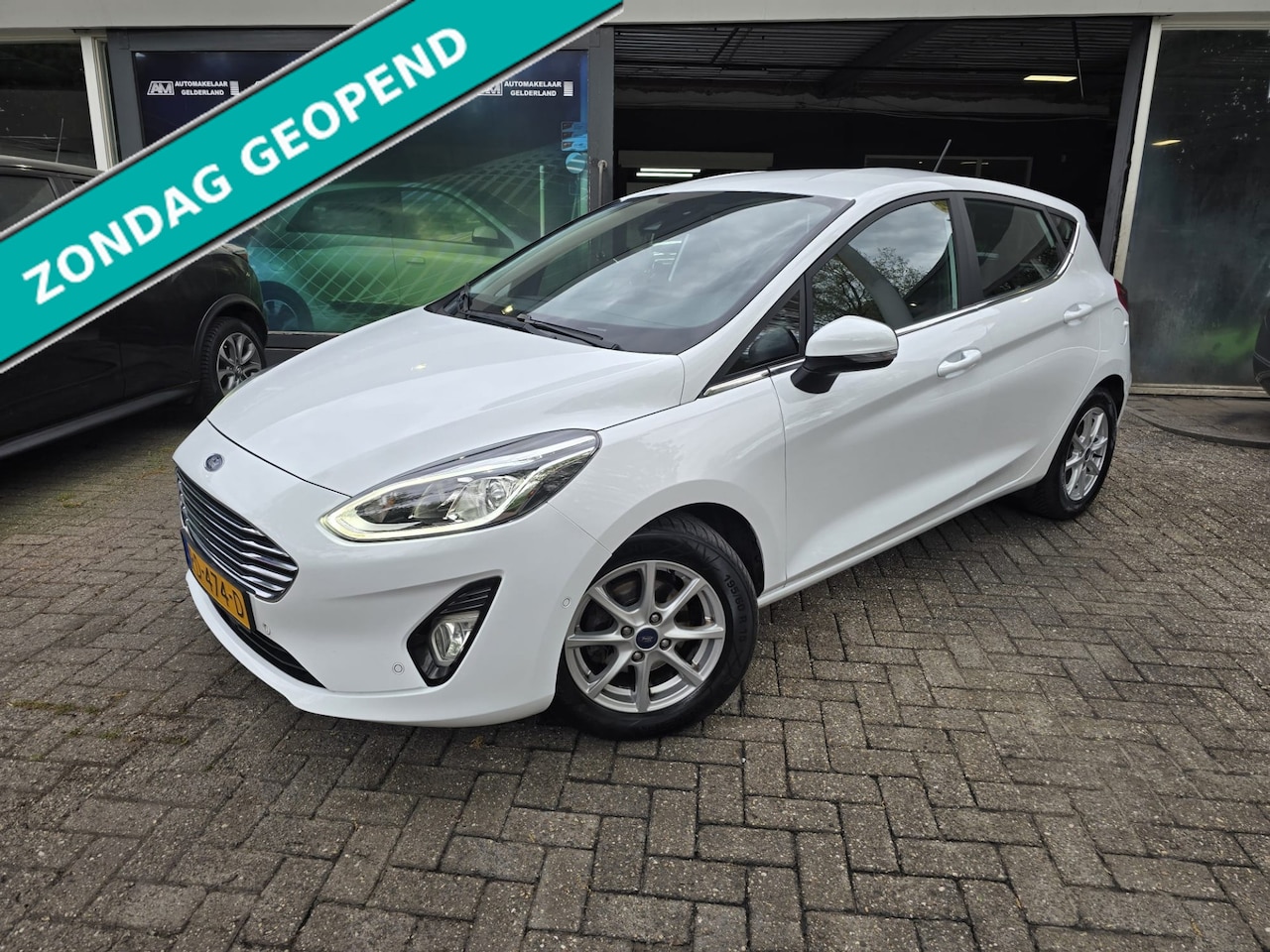 Ford Fiesta - 1.0 EcoBoost Titanium | AUTOMAAT | 2E EIGENAAR | 12MND GARANTIE | NAVI | CAMERA | - AutoWereld.nl
