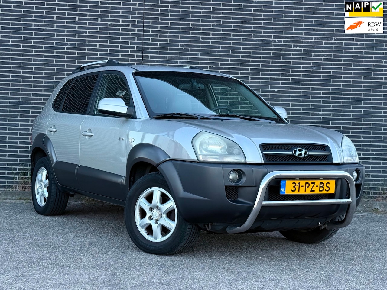 Hyundai Tucson - 2.7i V6 4WD Style Automaat, Clima, Cruise! - AutoWereld.nl
