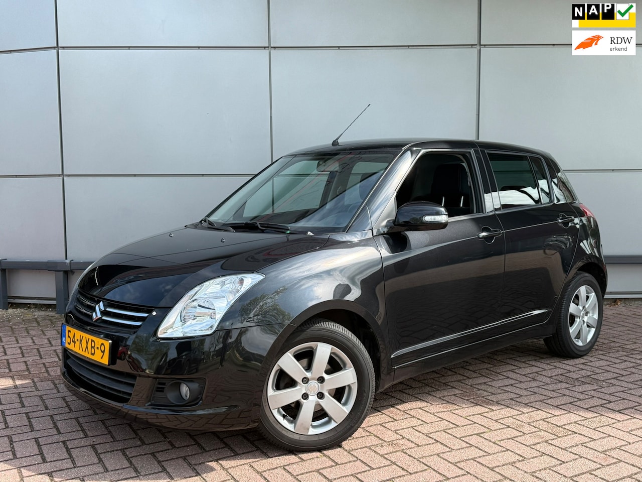 Suzuki Swift - 1.3 Limited | Carplay | Dealeronderhouden | Uniek lage km stand | - AutoWereld.nl
