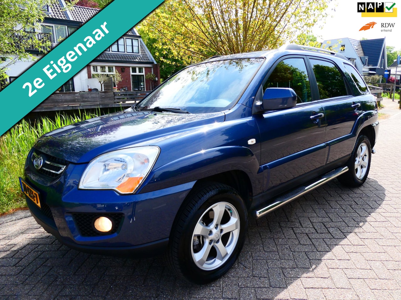 Kia Sportage - 2.0 CVVT Fifteen 2e eig. Clima Cruise Kanteldak Trekhaak 1400kg. - AutoWereld.nl