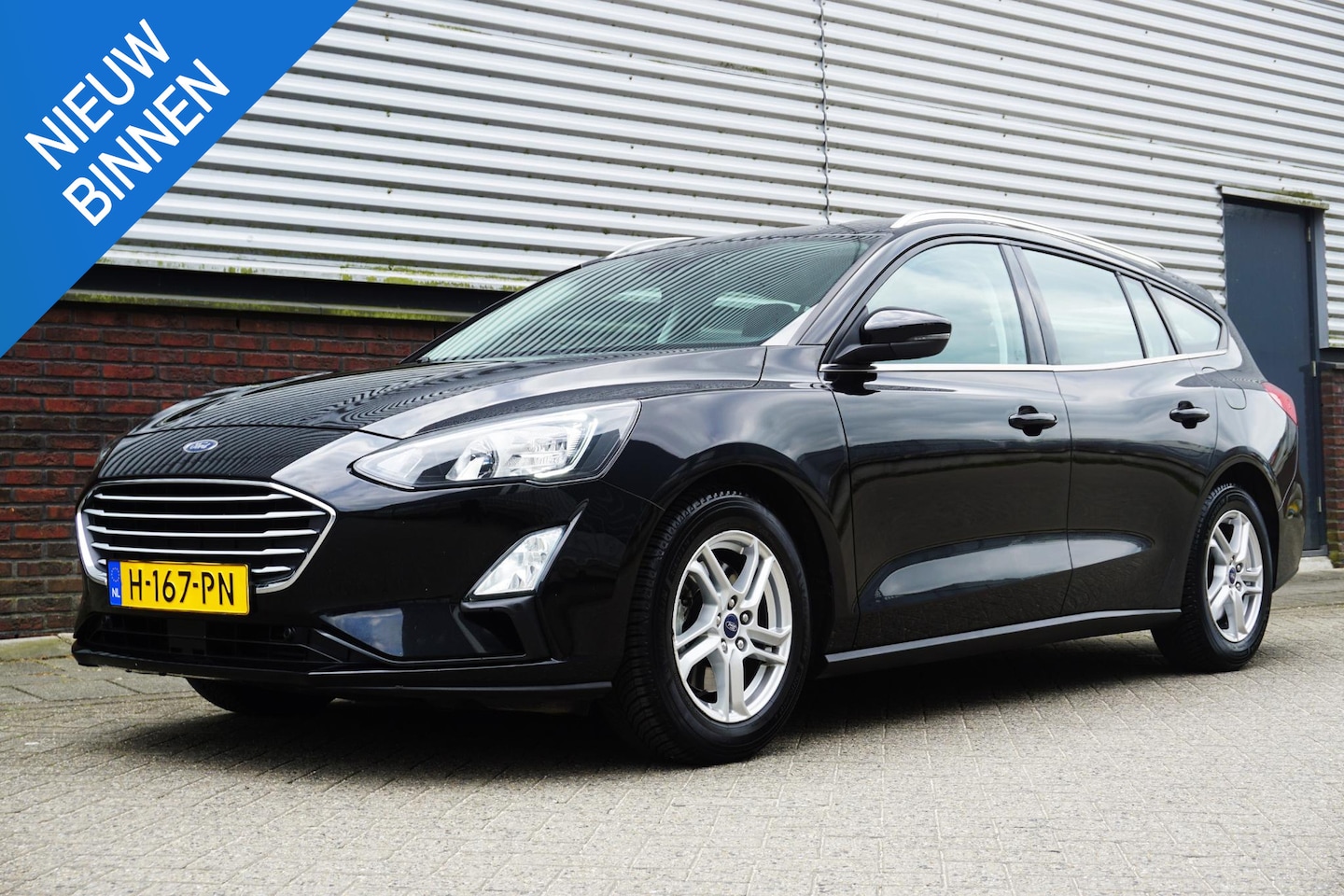 Ford Focus Wagon - 1.0 EcoBoost Edition Business/Navigatie/Cruise/ Black Metallic. - AutoWereld.nl