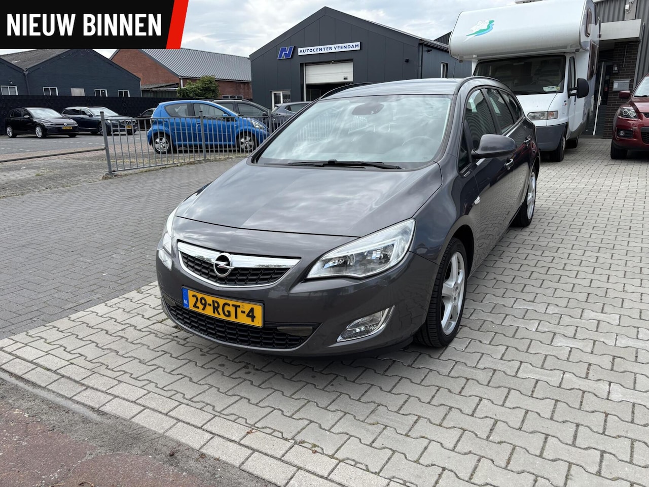 Opel Astra Sports Tourer - 1.4 Turbo Airco Cruise Trekhaak - AutoWereld.nl