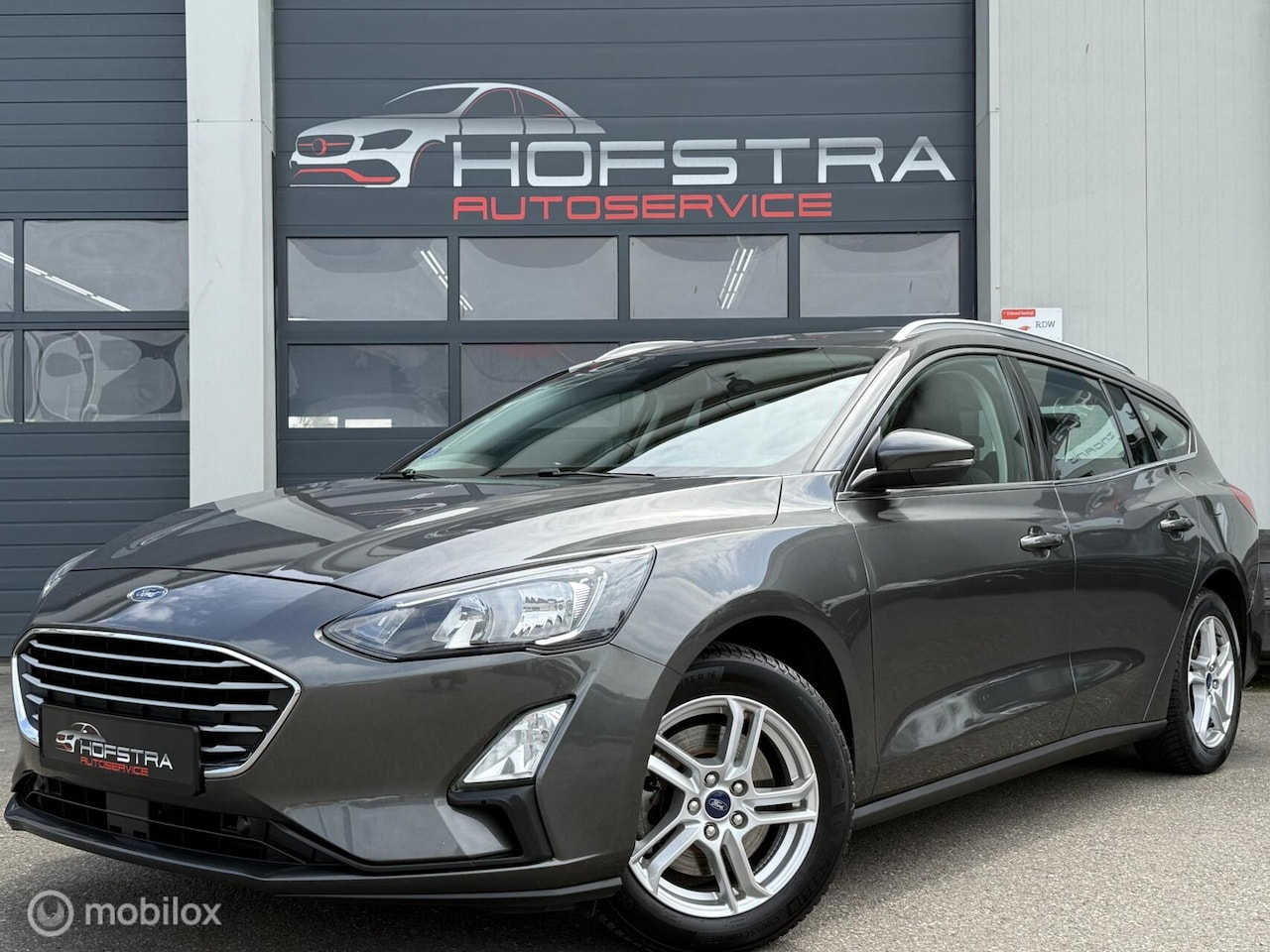 Ford Focus Wagon - 1.0 EcoBoost Trekhk CarPlay stoel/stuurverw. - AutoWereld.nl