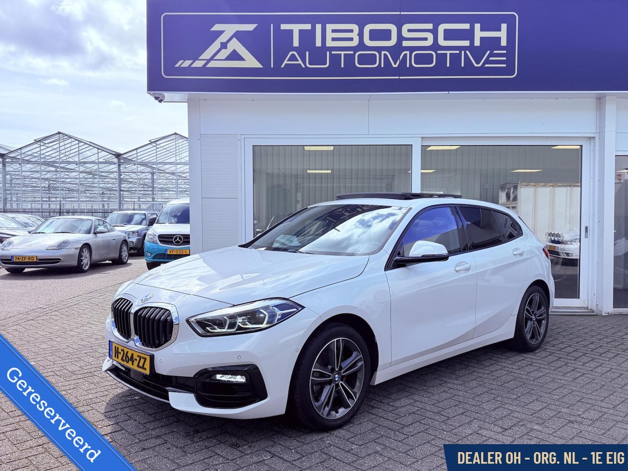 BMW 1-serie - 118i Sport-Line AUT. Pano Leder Head-up Keyless - AutoWereld.nl
