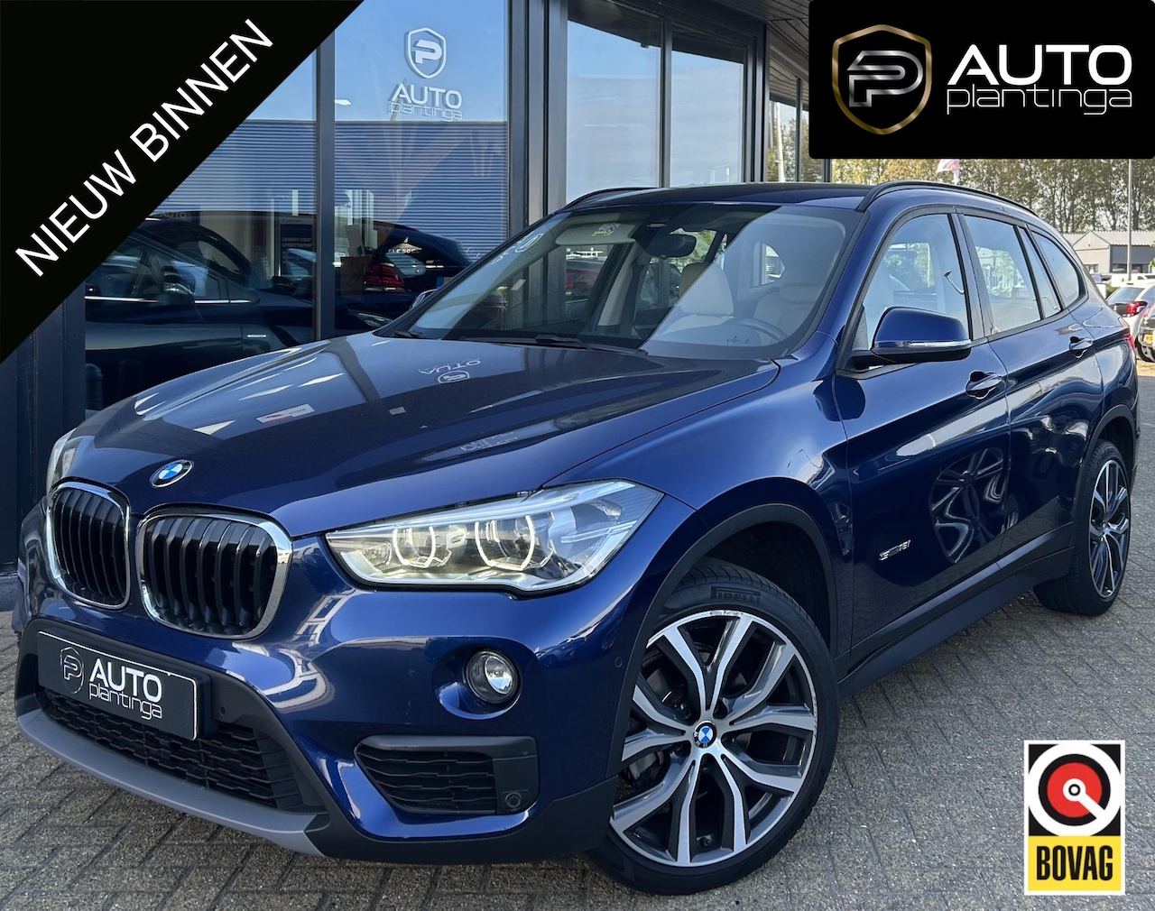 BMW X1 - sDrive18i High Executive | NL AUTO | Automaat | Achteruitrijcamera | Navigatie | Parkeerse - AutoWereld.nl