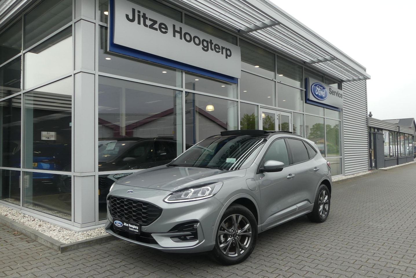 Ford Kuga - 2.5 PHEV ST-Line X ELEKT. TREKHAAK (1.500KG), PANO, HUD, WINTER PACK, ADAPT. CRUISE, CLIMA - AutoWereld.nl