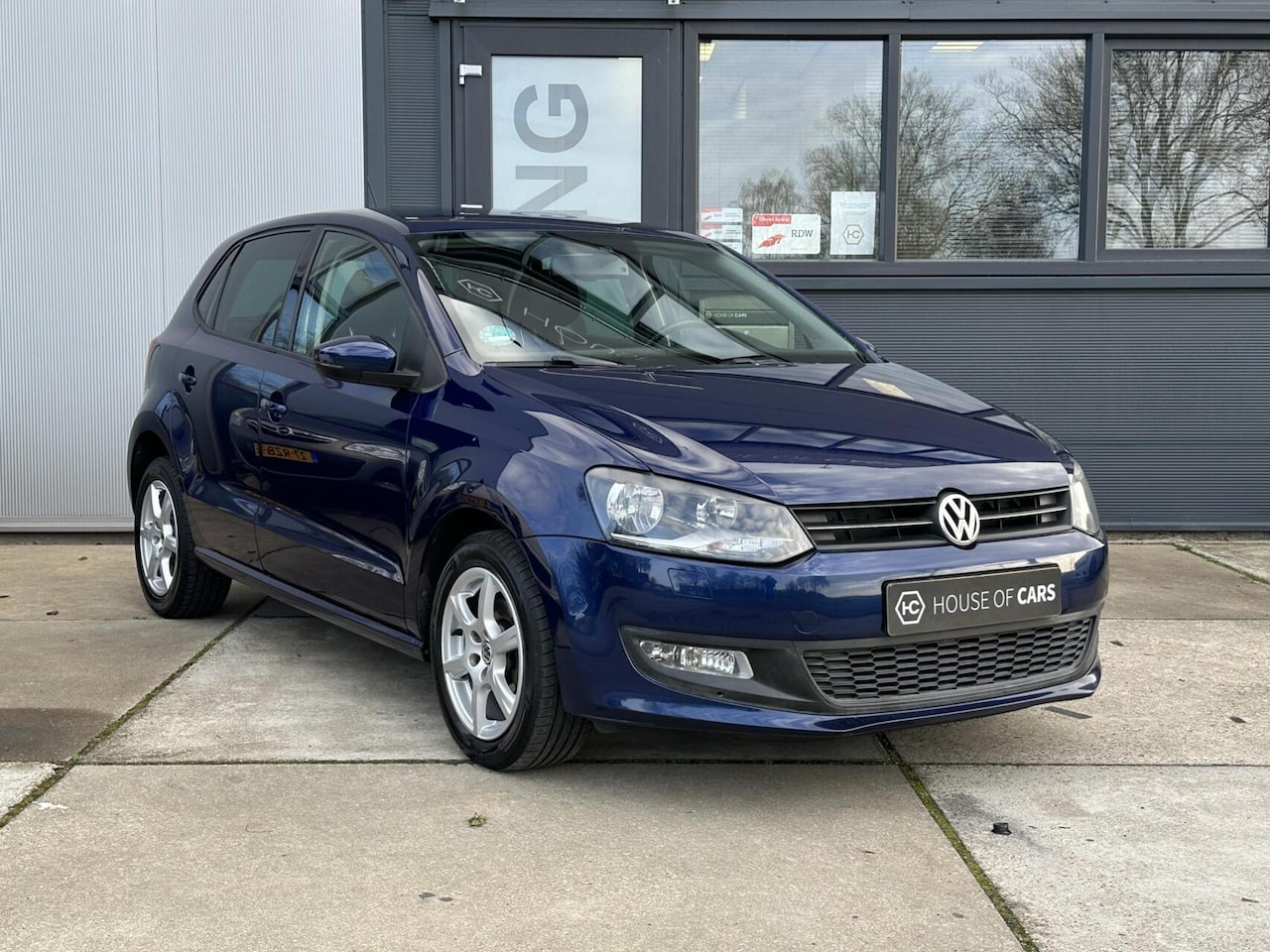 Volkswagen Polo - 1.2 Comfortline 5-Deurs Clima Cruise Navi - AutoWereld.nl