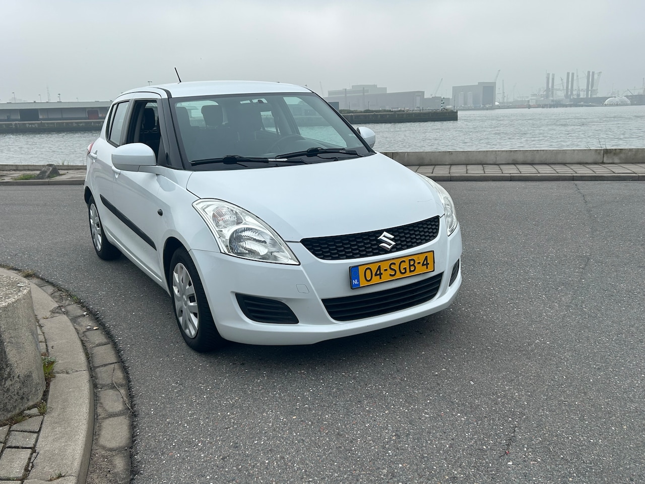 Suzuki Swift - 1.2 Comfort EASSS AIRCO STOELVERWARMING NETTE AUTO - AutoWereld.nl