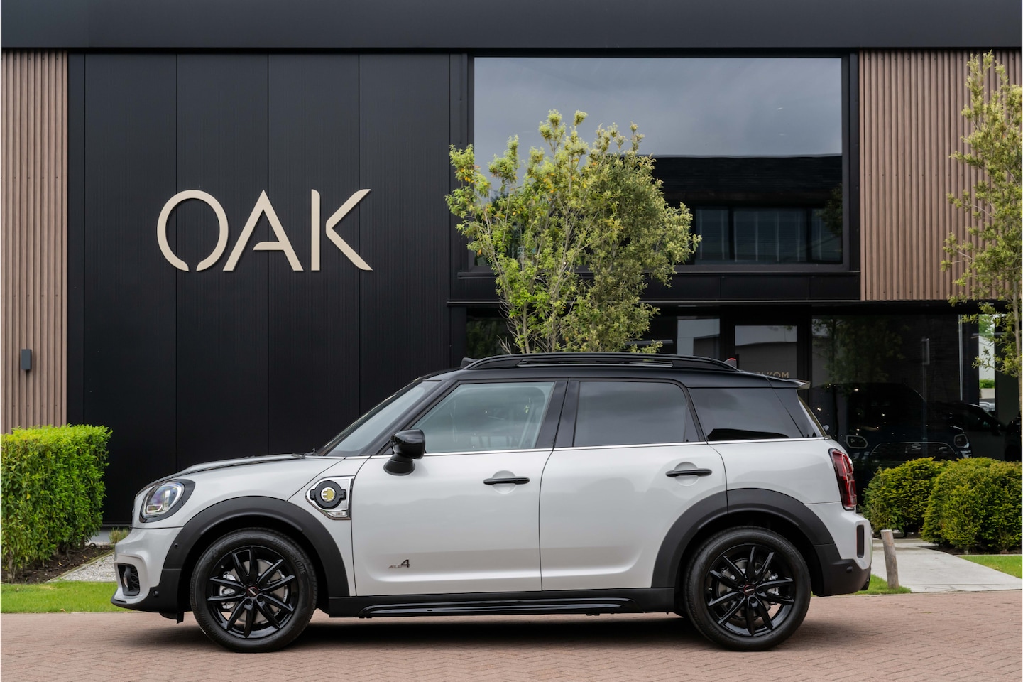 MINI Countryman - 1.5 Cooper SE Hybride ALL4 JCW-Trim | Navigatie | Panorama | Half Leder | Camera | Head-Up - AutoWereld.nl