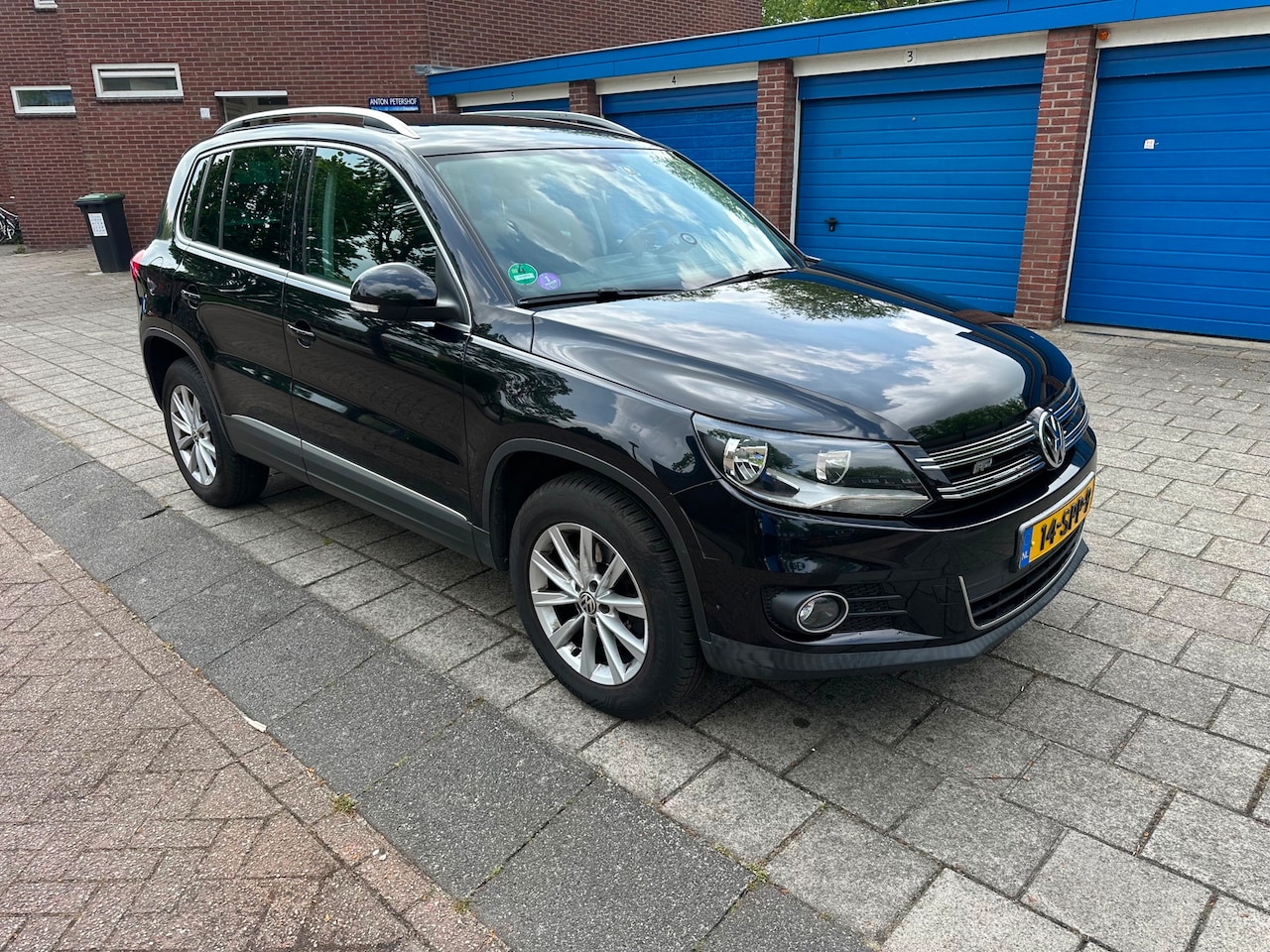 Volkswagen Tiguan - 1.4 TSI Sport&Style 4Motion Climate Cruise Black Edition - AutoWereld.nl