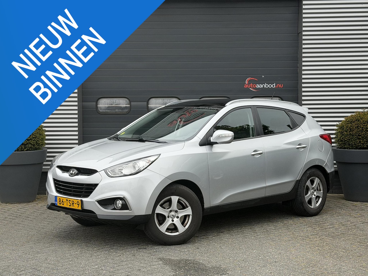 Hyundai ix35 - 2.0 CRDi Business Edition | Panoramadak | Camera | Navigatie | Trekhaak | - AutoWereld.nl