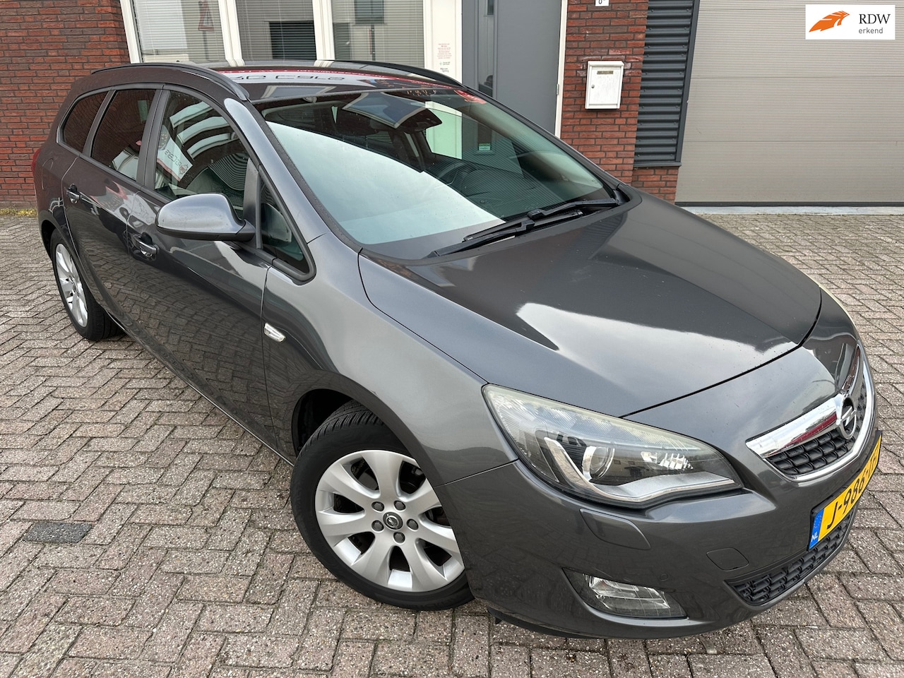 Opel Astra Sports Tourer - 1.6 Turbo Cosmo / Airco / PDC / Cruise / NAP / LM - AutoWereld.nl