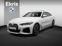 BMW i4 - eDrive40 M Sportpakket Pro | Stuurwielrand Verwarmd | Achteruitrijcamera | Schuifdak | DAB