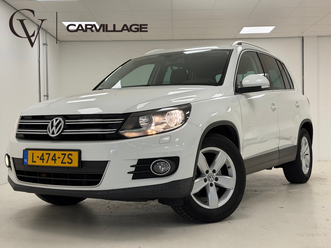 Volkswagen Tiguan - 1.4 TSI Sport&Style | Navi | Stoelverwarming | Clima Stoelverwarming | Navi - AutoWereld.nl