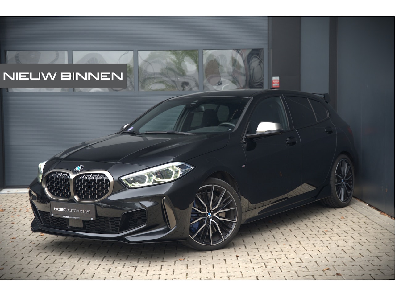 BMW 1-serie - M135i xDrive High Executive Edition | M Performance | Stoelverwarming | Cruise Control | A - AutoWereld.nl