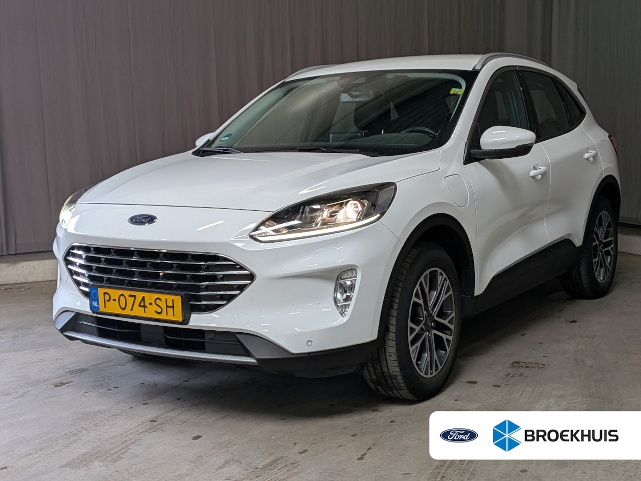 Ford Kuga - 2.5 PHEV Titanium | NL-AUTO! | 1E EIGENAAR! | ELEKTR. TREKHAAK | WINTERPACK | CAMERA | PAR - AutoWereld.nl