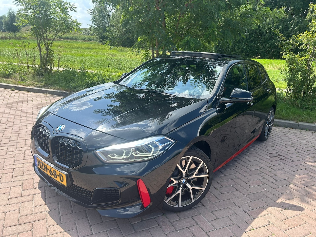 BMW 1-serie - 128ti Pano, Rode accenten, Apple carplay, sportstoelen - AutoWereld.nl