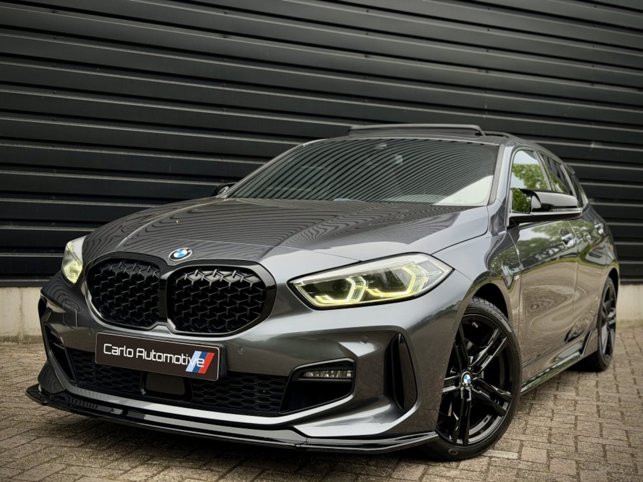 BMW 1-serie - 118i M-PERF. M135 PANO|SCHAALSTOEL|HUD|CAMERA - AutoWereld.nl