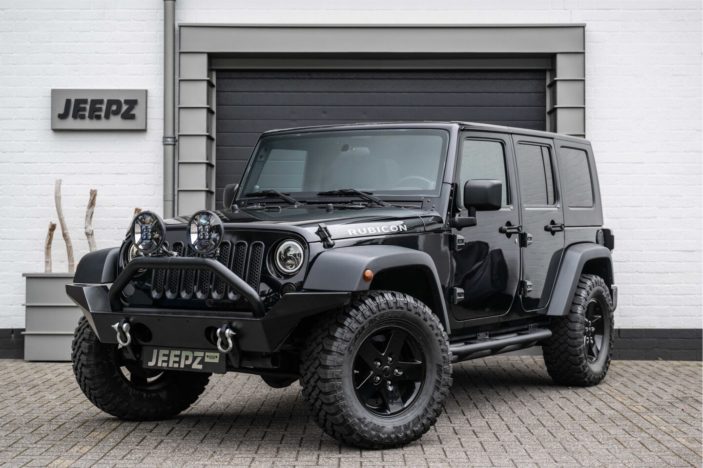 Jeep Wrangler Unlimited - 3.8 Sport / Black Jeepz edition - AutoWereld.nl