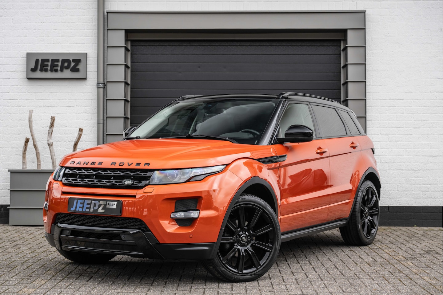 Land Rover Range Rover Evoque - 2.0 Si 4WD Autobiography / Panoramadak / Phoenix Orange - AutoWereld.nl