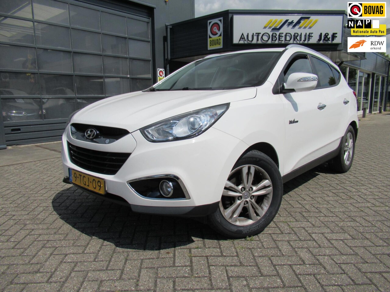 Hyundai ix35 - 1.6i GDI i-Catcher / NAV / ECC / Stoelverwarming / Half Leder - AutoWereld.nl