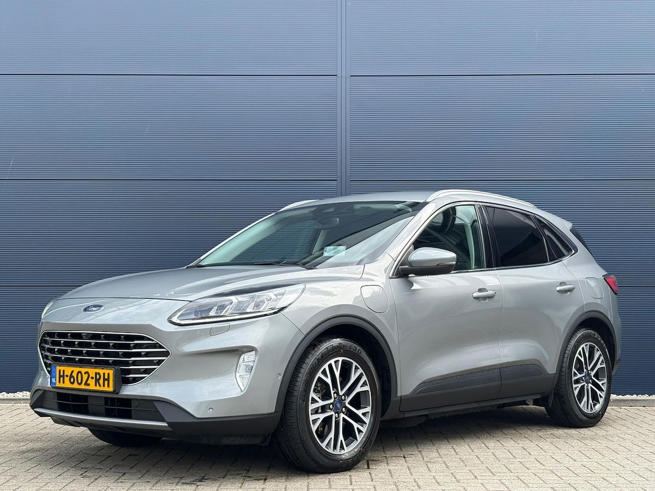 Ford Kuga - 2.5 PHEV e-CVT 225pk Titanium X | Navigatie | Climate control | Camera | Stuur/stoel verwa - AutoWereld.nl
