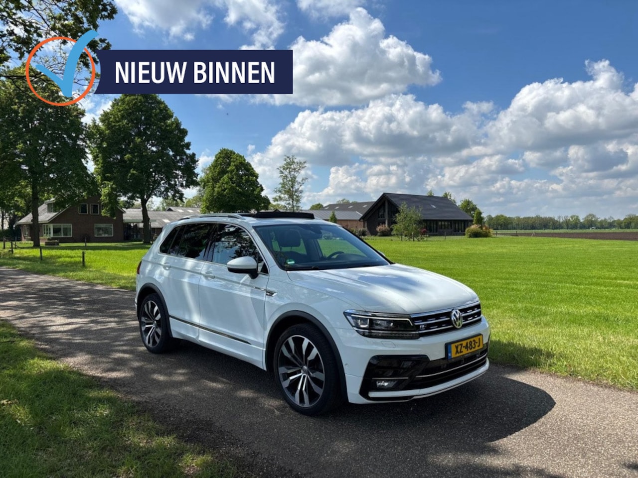 Volkswagen Tiguan - 2.0 TSI 4motion | R-line | Panoramadak | Trekhaak | Camera | - AutoWereld.nl