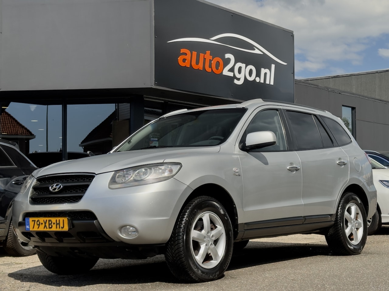 Hyundai Santa Fe - 2.7i V6 AUT4 4WD STYLE 7PERS LEDER NAVI AIRCO LED LMV PDC - AutoWereld.nl