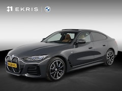 BMW i4 - eDrive40 High Executive 84 kWh Dravitgrau met Cognac Volleder | M Sport | Elektrisch Schui