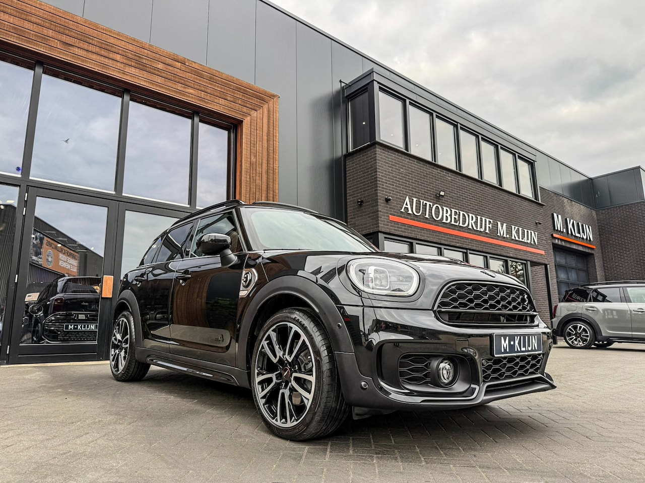 MINI Countryman - Mini Cooper S E ALL4 John Cooper Works 220pk/Leer/Memory/Hk/Camera/Pano/Btw - AutoWereld.nl