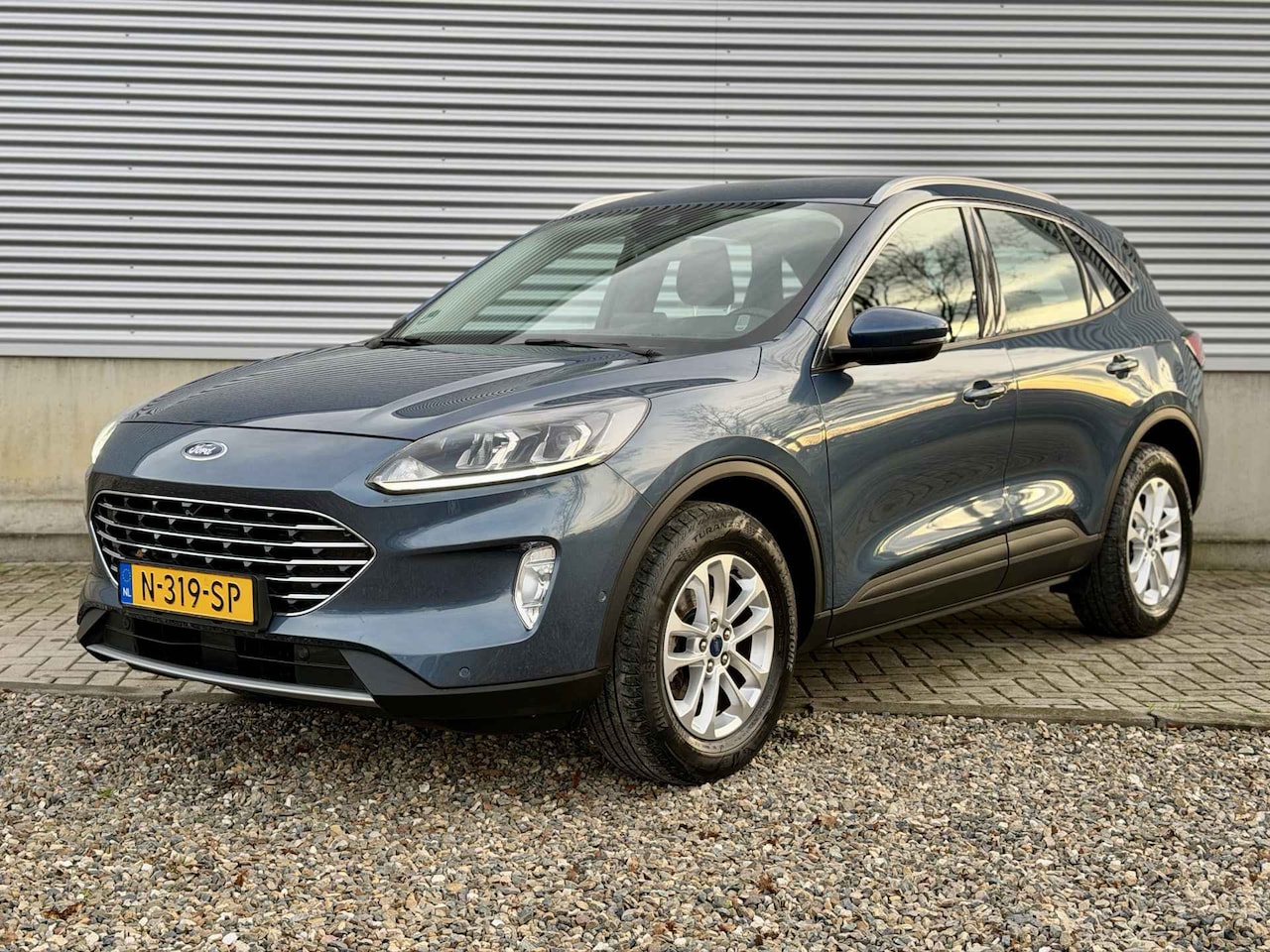 Ford Kuga - 1.5 EcoBoost Titanium [ adpt cruise, Pack winter, Navi ] - AutoWereld.nl
