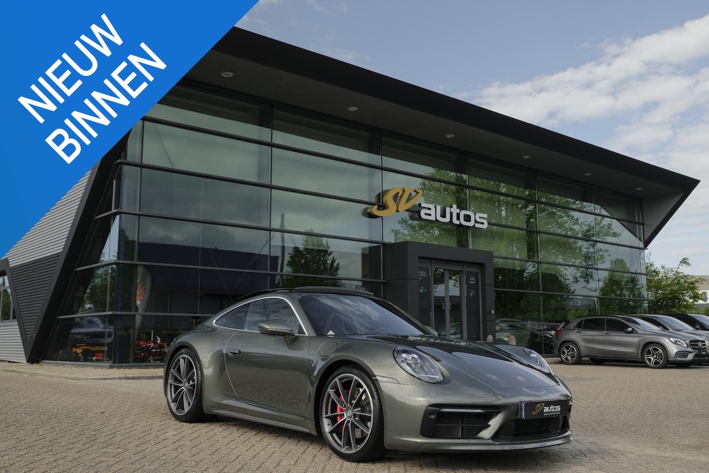 Porsche 911 - 3.0 Carrera S 450pk Panoramadak NLauto Sport design Aventurin groen Noselift 18-weg sports - AutoWereld.nl